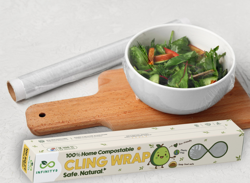 Infinity9 Cling wrap packaging with a bowl of salad and wooden cutting board on a light background
